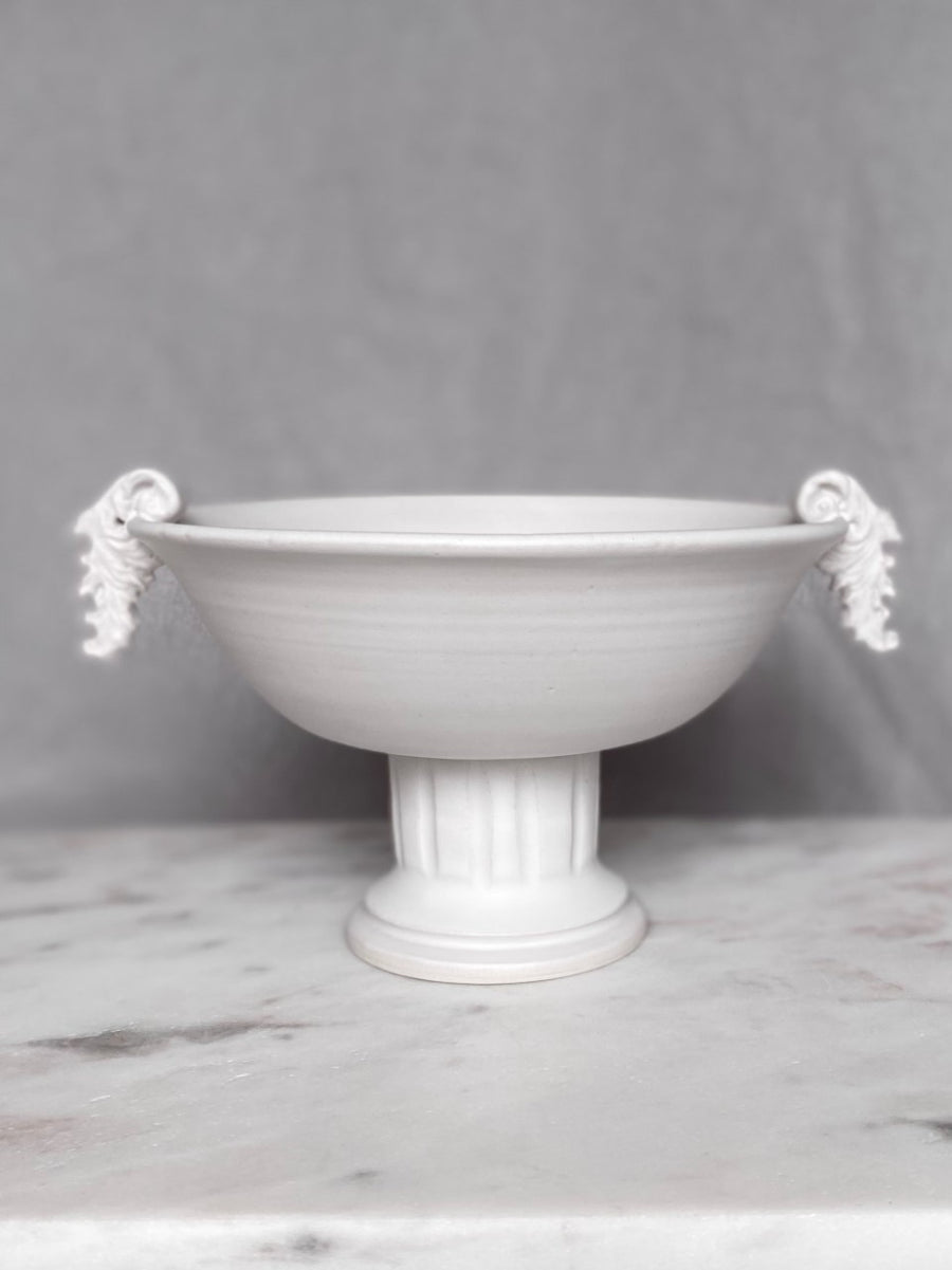 Ceramic pedestal bowl with handles
